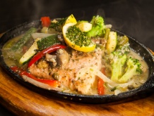 a salmon dish with lemon and brocolli