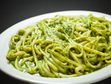 a bowl of green noodles